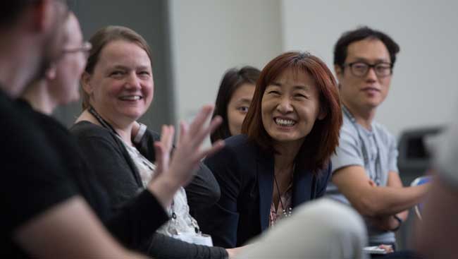 Neuroscientists network at an event. 