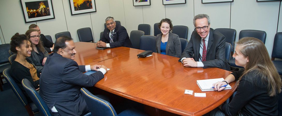 Photo of eight people sitting around a table advocating for neuroscience during SfN's Capitol Hill Day 2017