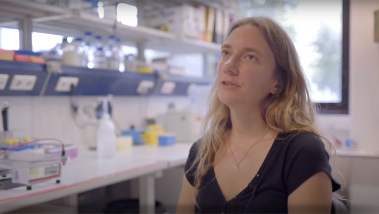 Nadine Gogolla sitting in a lab during an interview.