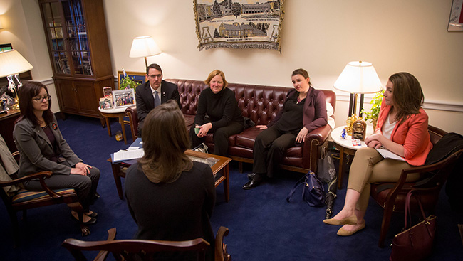 Photo of neuroscientists and politicians having conversation during SfN's Capitol Hill Day 2017