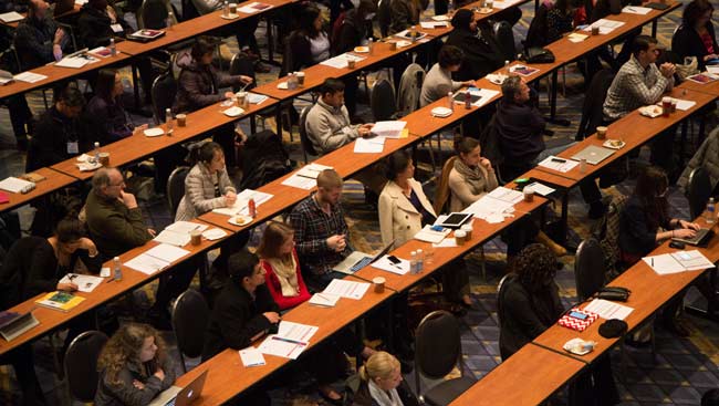 Students attend a lecture. 