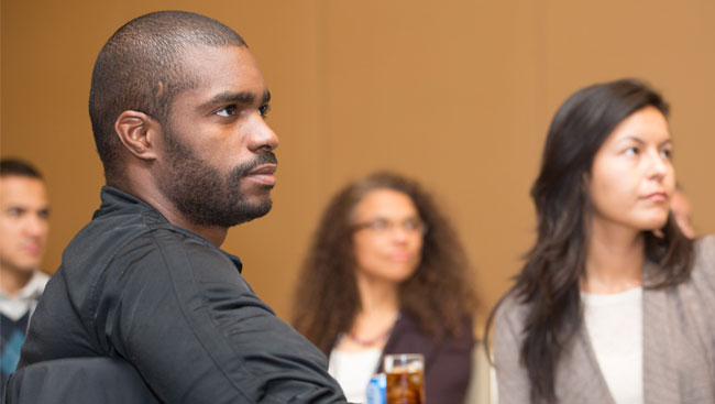 Neuroscientists listen to a speaker.