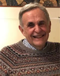Image of Nick Ingoglia smiling wearing a sweater.